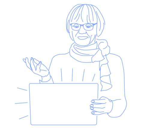 Tarja Rapala-Virtanen giving a presentation behind a laptop with her right arm stretched.